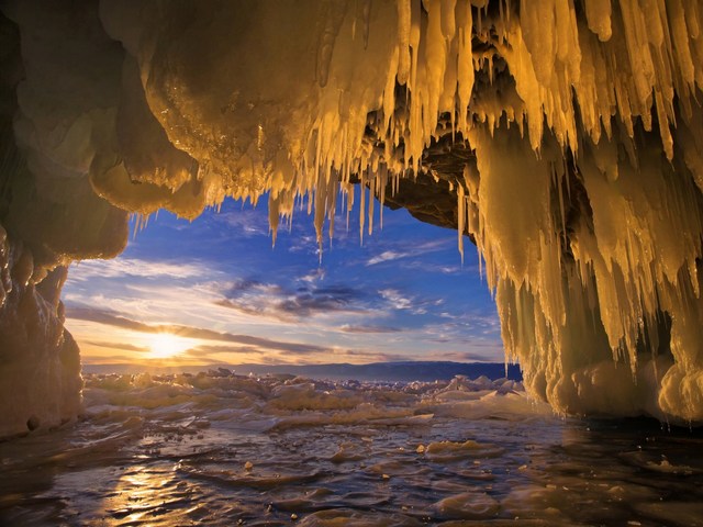 Baikal Ice Cave Landscape Russia - Beautiful landscape with sunset, viewed through sparkling stalactites from inside an ice cave on Olkhon Island in Lake Baikal, Russia. <br />
The lake Baikal is located in the south of the Russian region of Siberia, between Irkutsk Oblast and the Buryat Republic, near the Mongolian border. It is the oldest (at 25 million years), deepest (with a maximum depth of 1,642 m) and clearest freshwater lake in the world. The lake Baikal, with its 23,615.39 km3, is the most voluminous freshwater lake, containing roughly 20% of the world's unfrozen fresh water.<br />
In winter, the lake Baikal is transformеd to the realm of the great ice and mighty winds, which lead to fascinating phenomena building beautiful and incredible ice formations. - , Baikal, ice, cave, caves, landscape, landscapes, Russia, naure, natures, sunset, stalactite, stalactite, cave, caves, Olkhon, island, lake, lakes, Russian, region, regions, Siberia, Irkutsk, oblast, Buryat, republic, republics, Mongolian, border, borders, freshwater, freshwaters, unfrozen, fresh, water, winter, realm, ice, ices, mighty, winds, wind, which, lead, to, fascinating, phenomena, incredible, formations, formation - Beautiful landscape with sunset, viewed through sparkling stalactites from inside an ice cave on Olkhon Island in Lake Baikal, Russia. <br />
The lake Baikal is located in the south of the Russian region of Siberia, between Irkutsk Oblast and the Buryat Republic, near the Mongolian border. It is the oldest (at 25 million years), deepest (with a maximum depth of 1,642 m) and clearest freshwater lake in the world. The lake Baikal, with its 23,615.39 km3, is the most voluminous freshwater lake, containing roughly 20% of the world's unfrozen fresh water.<br />
In winter, the lake Baikal is transformеd to the realm of the great ice and mighty winds, which lead to fascinating phenomena building beautiful and incredible ice formations. Resuelve rompecabezas en línea gratis Baikal Ice Cave Landscape Russia juegos puzzle o enviar Baikal Ice Cave Landscape Russia juego de puzzle tarjetas electrónicas de felicitación  de puzzles-games.eu.. Baikal Ice Cave Landscape Russia puzzle, puzzles, rompecabezas juegos, puzzles-games.eu, juegos de puzzle, juegos en línea del rompecabezas, juegos gratis puzzle, juegos en línea gratis rompecabezas, Baikal Ice Cave Landscape Russia juego de puzzle gratuito, Baikal Ice Cave Landscape Russia juego de rompecabezas en línea, jigsaw puzzles, Baikal Ice Cave Landscape Russia jigsaw puzzle, jigsaw puzzle games, jigsaw puzzles games, Baikal Ice Cave Landscape Russia rompecabezas de juego tarjeta electrónica, juegos de puzzles tarjetas electrónicas, Baikal Ice Cave Landscape Russia puzzle tarjeta electrónica de felicitación