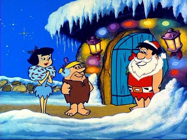 Christmas Flintstone Santa Claus - Fred Flintstone as Santa Claus welcomes Barney and Betty Rubble in a scene from 